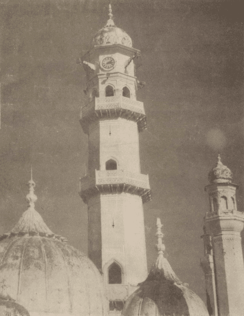 What is meant by two yellow garments in the context of the Promised Messiah’s advent?