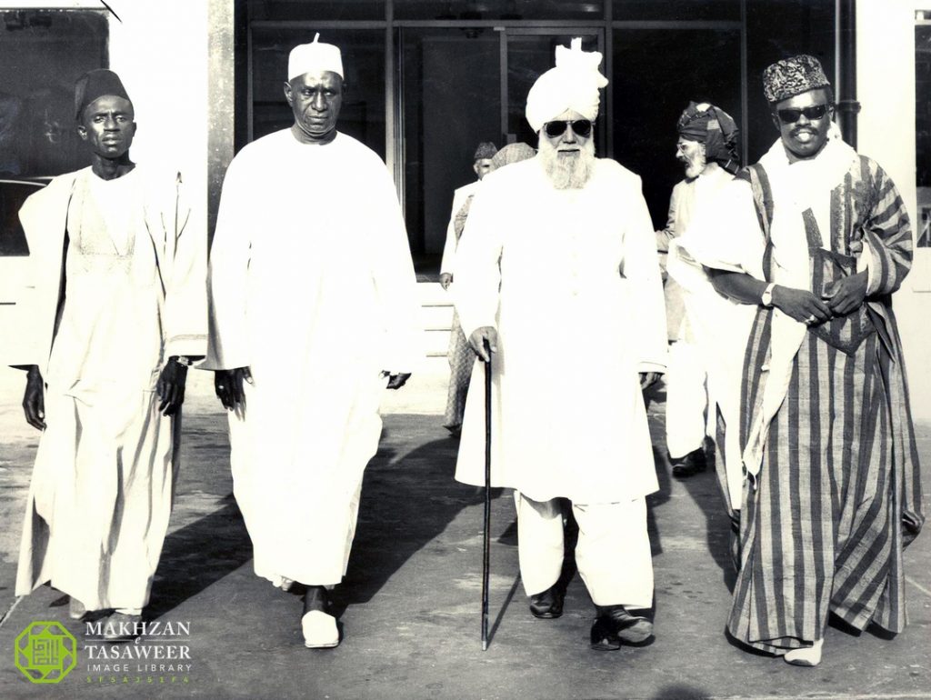Hazrat Khalifatul Masih III proceeds to a reception hosted in his honour. On Huzoors right is Mr. F. M. Singateh Governor General of The Gambia The Gambia 2nd May 1970