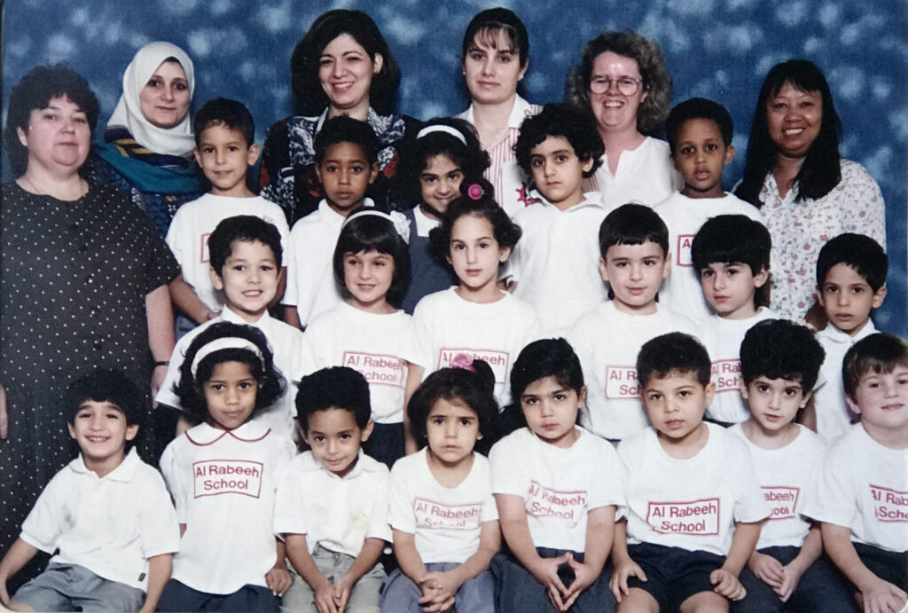 Taalay first child on the left second row. Miss Karen in the back row wearing glasses