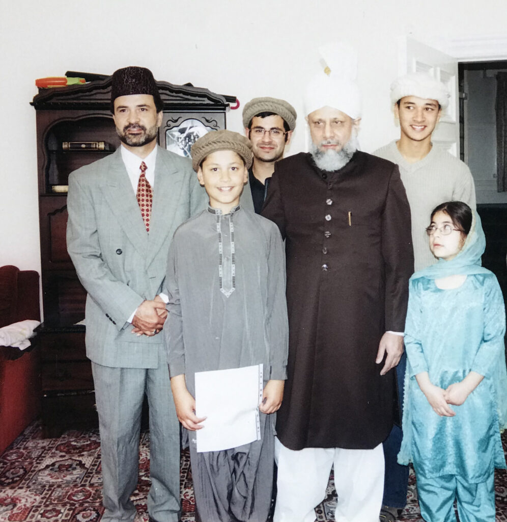 Taalay on the right in the company of Huzoor during his college going days
