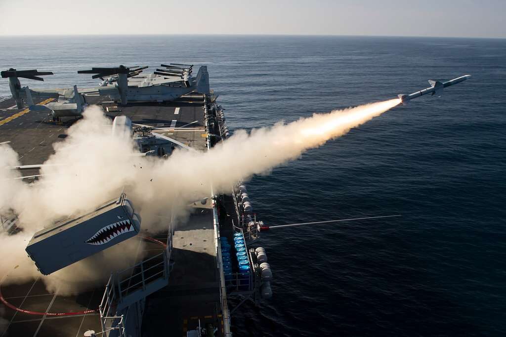 a rim 7 nato sea sparrow missile nssm is fired from the forward launcher aboard 74cc70