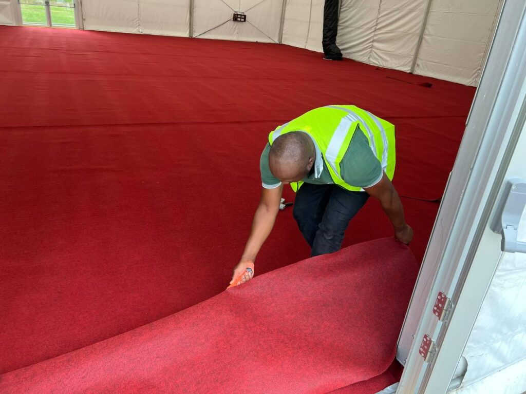 The hustle and bustle before Jalsa Salana UK 2025: Preparations in pictures 21 The carpet being laid down in the accommodation marquees
