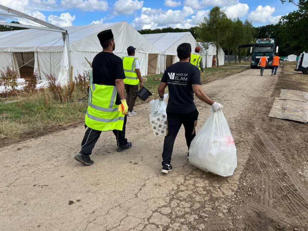 The hustle and bustle before Jalsa Salana UK 2025: Preparations in pictures 22 A volunteer for the hygiene department makes sure that toilet supplies are stocked up